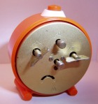 Ruhla Orange Alarm Clock Winding and Setting Controls